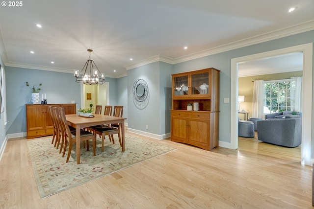 2645 SW Upper Drive Pl, Portland, OR 97201 - dining space with a chandelier, light wood-type flooring, baseboards, recessed lighting, and crown molding