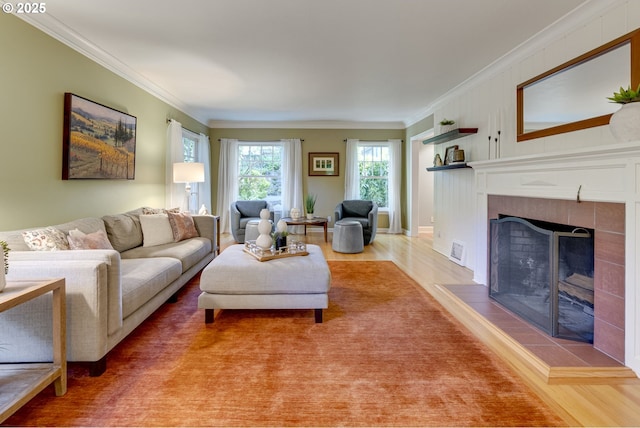 2645 SW Upper Drive Pl, Portland, OR 97201 - living room with light wood-style floors, ornamental molding, and a tiled fireplace