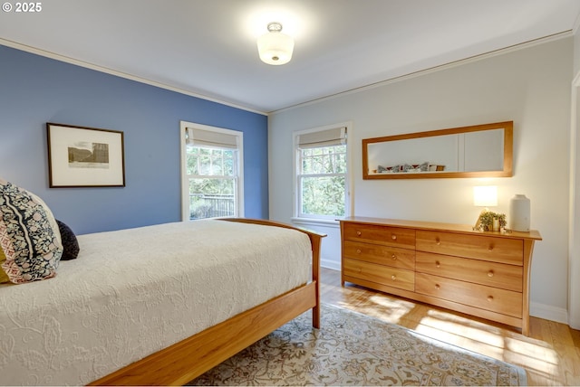 2645 SW Upper Drive Pl, Portland, OR 97201 - bedroom featuring crown molding, light wood-type flooring, and baseboards