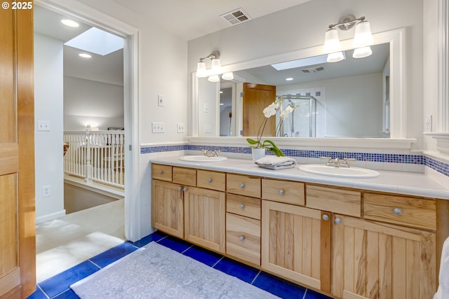 2645 SW Upper Drive Pl, Portland, OR 97201 - bathroom with double vanity, tile patterned flooring, a shower with shower door, and recessed lighting
