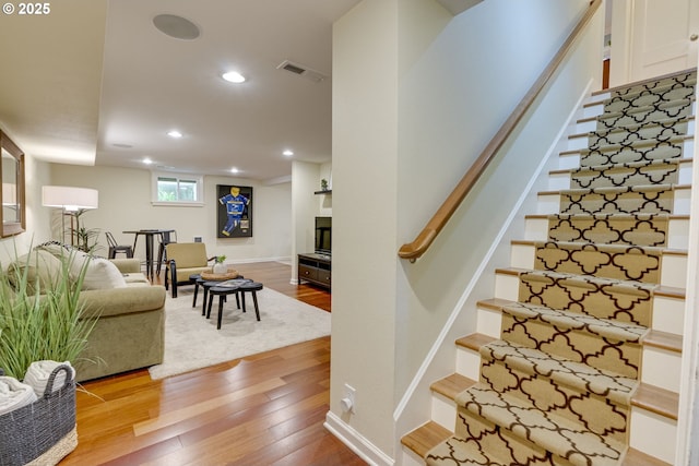 2645 SW Upper Drive Pl, Portland, OR 97201 - stairs featuring wood finished floors, recessed lighting, and baseboards