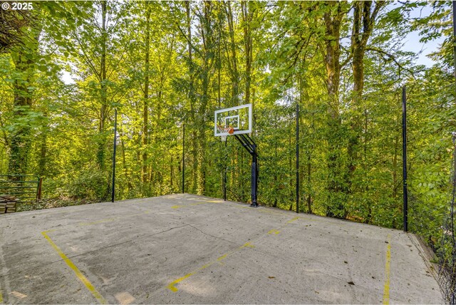 2645 SW Upper Drive Pl, Portland, OR 97201 - view of sport court featuring basketball hoop and a forest view