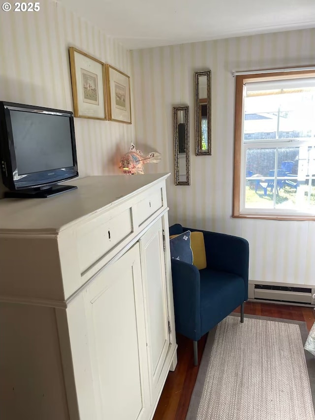 554 N Beacon St, Rockaway Beach, OR 97136 - living area with wallpapered walls, baseboard heating, and dark wood finished floors