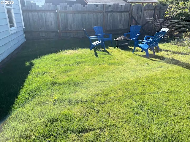 554 N Beacon St, Rockaway Beach, OR 97136 - view of yard featuring a fire pit
