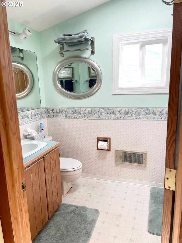 554 N Beacon St, Rockaway Beach, OR 97136 - half bathroom featuring wainscoting, vanity, and tile patterned floors