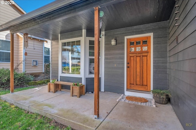 property entrance with covered porch