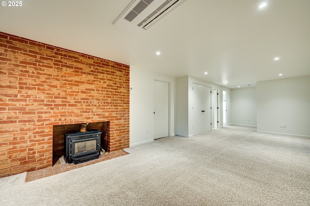 607 W 35th St, Vancouver, WA 98660 - unfurnished living room featuring carpet flooring, recessed lighting, and a wood stove