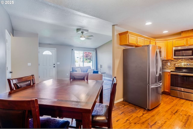 dining room featuring light wood finished floors, ceiling fan, recessed lighting, and baseboards