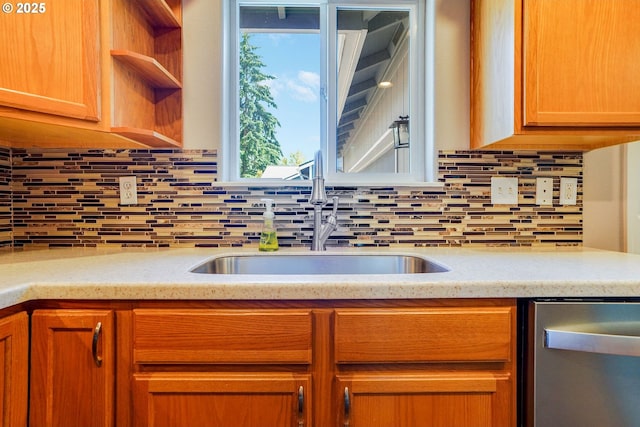 kitchen featuring dishwasher, a sink, tasteful backsplash, and open shelves