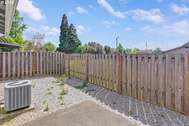 fenced backyard with central AC