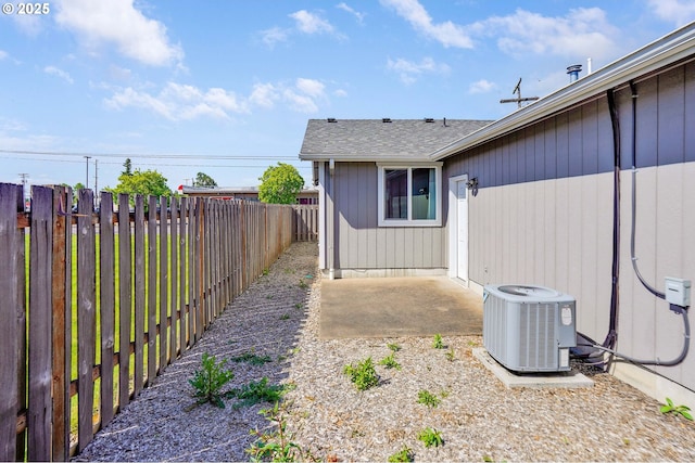 fenced backyard with cooling unit