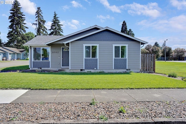 ranch-style house with a front lawn