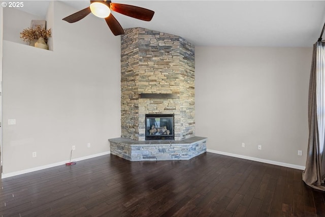 unfurnished living room featuring wood finished floors, baseboards, a ceiling fan, and lofted ceiling