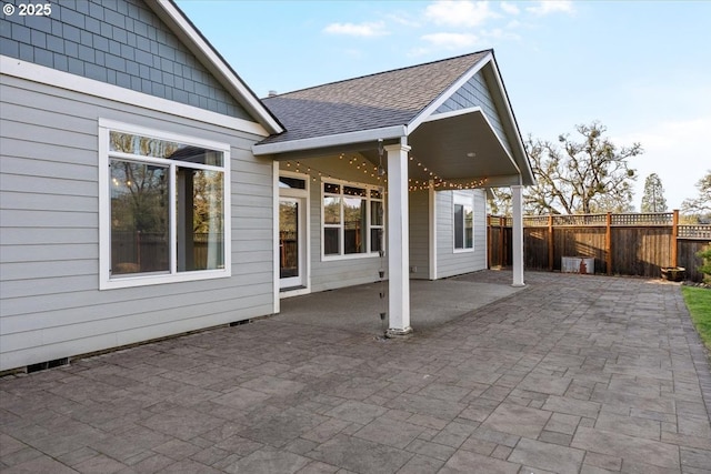 view of patio / terrace featuring fence