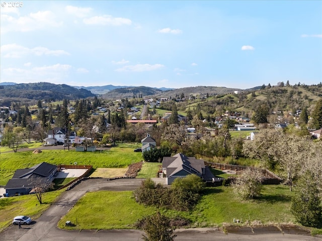 birds eye view of property with a mountain view and a residential view