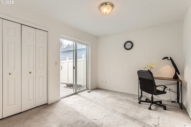 office space with light colored carpet