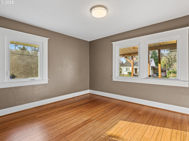 empty room featuring hardwood / wood-style floors