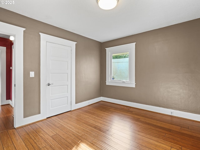 spare room with light wood-type flooring