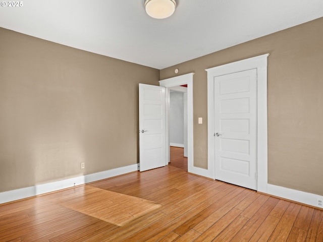 unfurnished room featuring hardwood / wood-style floors