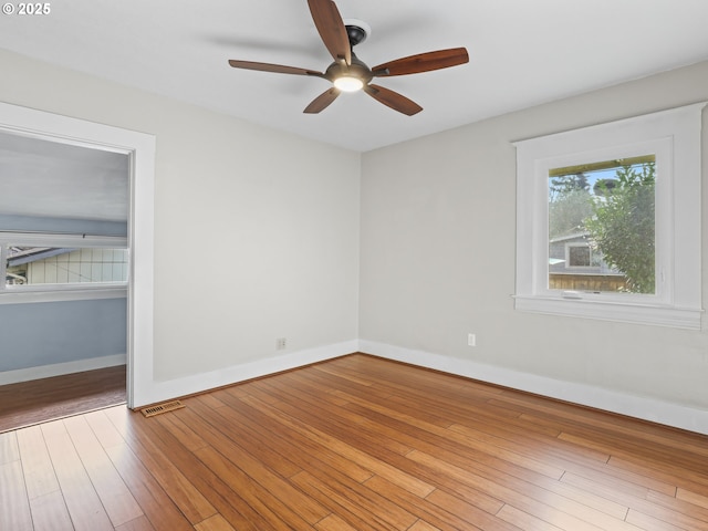 spare room with ceiling fan and light hardwood / wood-style floors