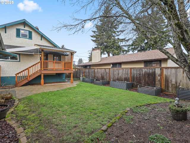 rear view of property featuring a lawn and a patio