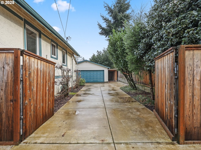 view of home's exterior with a garage and an outdoor structure