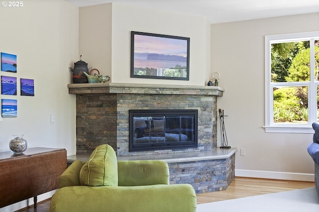 1221 SW Forest Meadows Way, Lake Oswego, OR 97034 - living area featuring wood finished floors and a stone fireplace