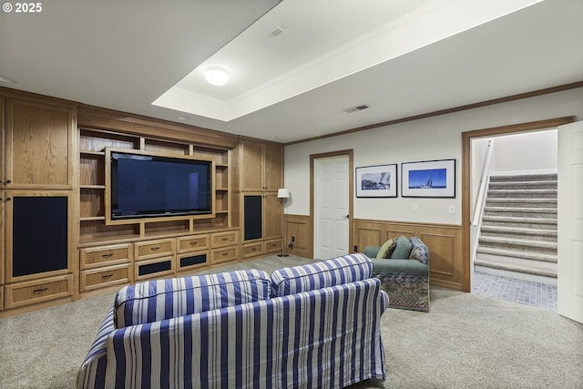 1221 SW Forest Meadows Way, Lake Oswego, OR 97034 - living area with light colored carpet, stairway, ornamental molding, and a wainscoted wall