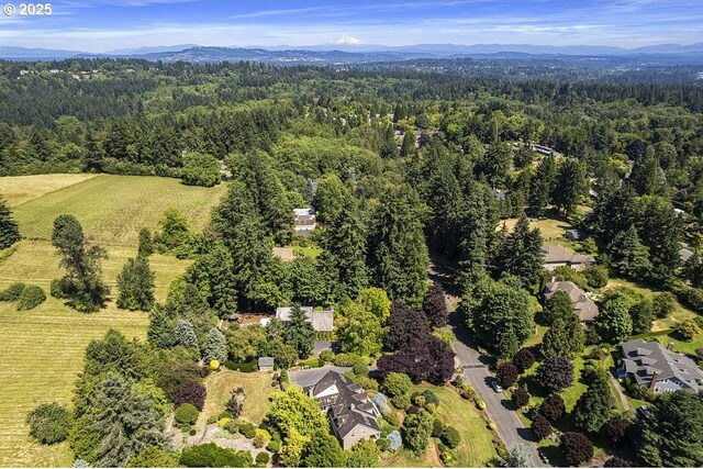 1221 SW Forest Meadows Way, Lake Oswego, OR 97034 - aerial overview of property's location with a heavily wooded area and a mountain backdrop