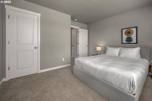 bedroom with carpet floors and baseboards