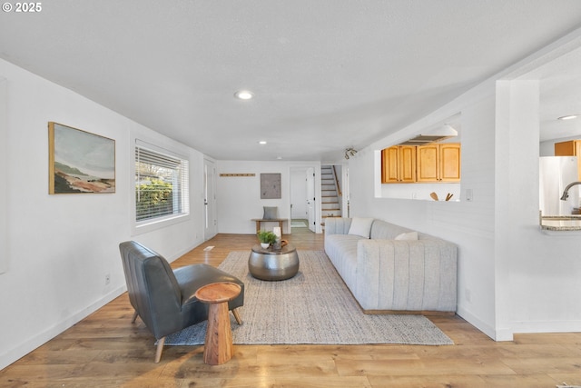 living room with light hardwood / wood-style flooring