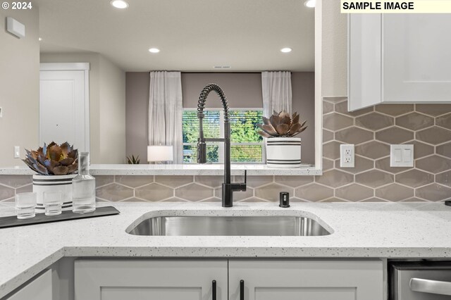 18407 NE 43rd Pl Lot 198, Vancouver, WA 98686 - kitchen with white cabinetry, tasteful backsplash, recessed lighting, light stone counters, and dishwasher