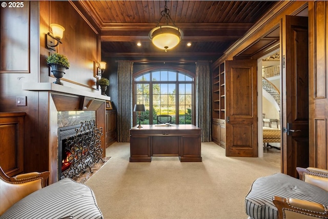 office area with wooden walls, light colored carpet, a premium fireplace, wooden ceiling, and beam ceiling