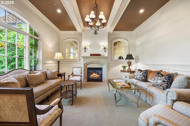 12955 NW Skyline Blvd, Portland, OR 97231 - carpeted living area featuring a chandelier, a decorative wall, beamed ceiling, a glass covered fireplace, and crown molding