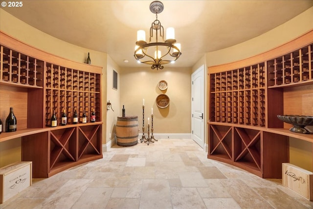 wine cellar featuring a notable chandelier