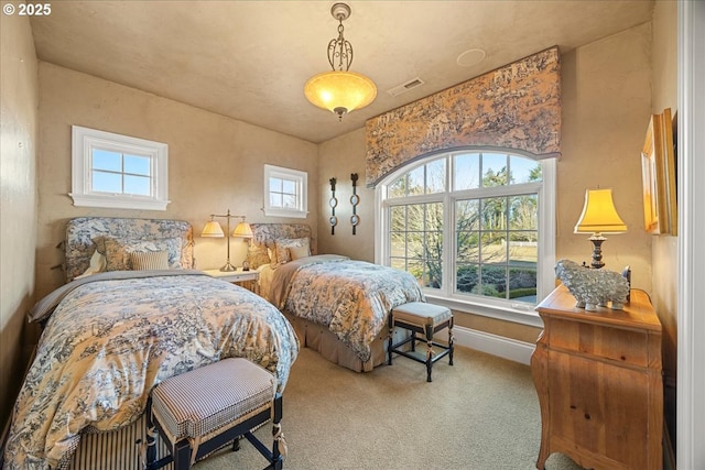 bedroom featuring light colored carpet