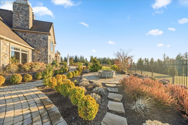 view of yard with a patio area and a fire pit