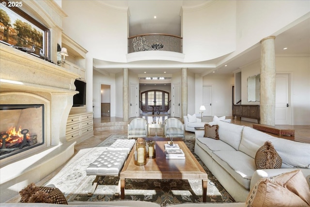 12955 NW Skyline Blvd, Portland, OR 97231 - living room with ornate columns, a high ceiling, crown molding, a fireplace, and recessed lighting