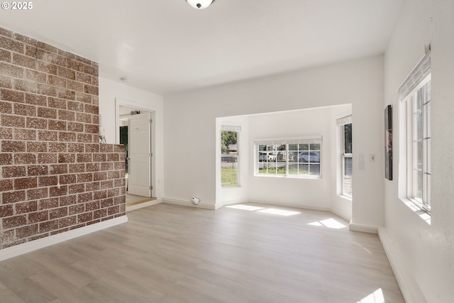 6139 SE 103rd Ave, Portland, OR 97266 - unfurnished living room featuring wood finished floors and baseboards