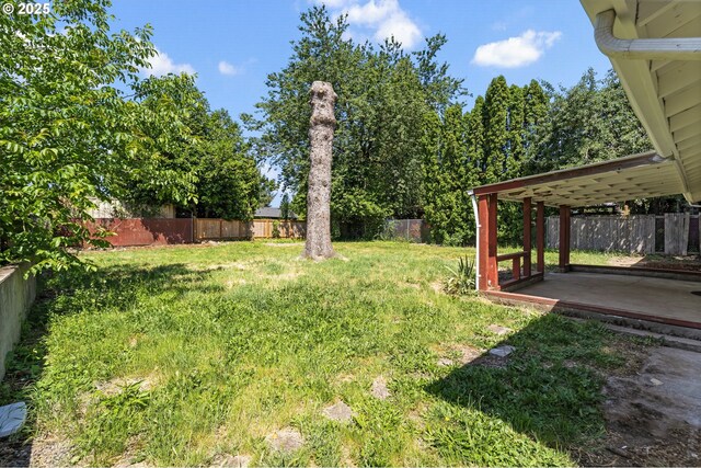 6139 SE 103rd Ave, Portland, OR 97266 - fenced backyard featuring a patio
