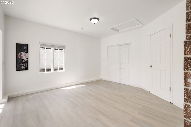 6139 SE 103rd Ave, Portland, OR 97266 - unfurnished bedroom featuring attic access, light wood finished floors, and a closet
