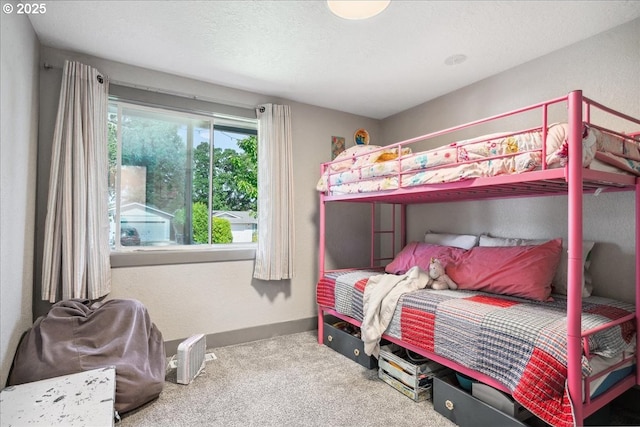 bedroom with carpet and baseboards
