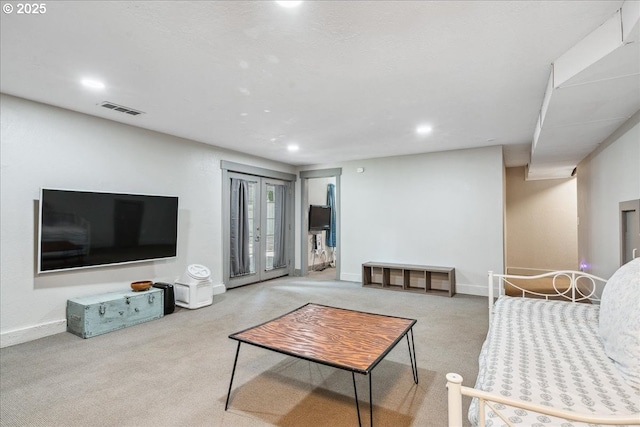 living room with carpet floors, recessed lighting, and baseboards