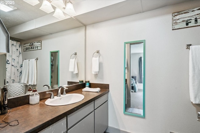 bathroom featuring vanity and a shower with curtain