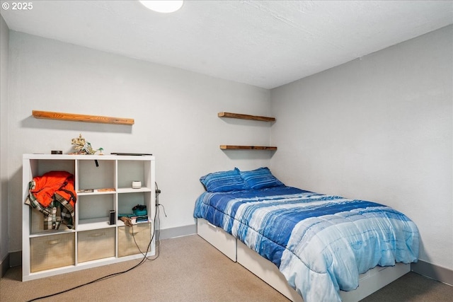bedroom featuring carpet floors and baseboards