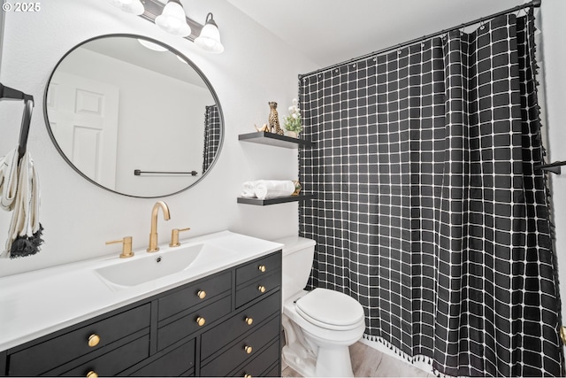 bathroom with toilet, curtained shower, and vanity