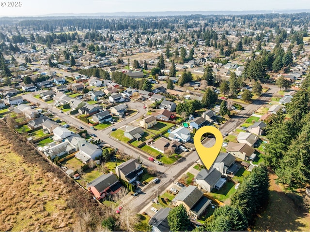 birds eye view of property with a residential view