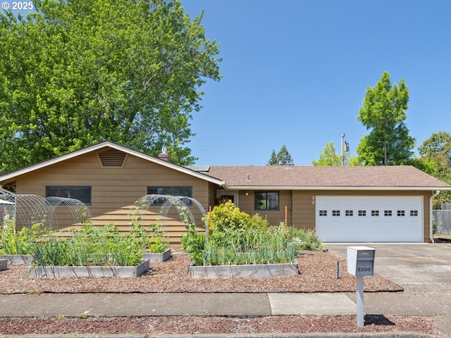 2250 NW Highland Dr, Corvallis, OR 97330 - ranch-style home with a garden, driveway, and an attached garage