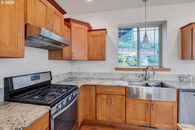 kitchen featuring stainless steel appliances, sink, light stone countertops, ventilation hood, and pendant lighting