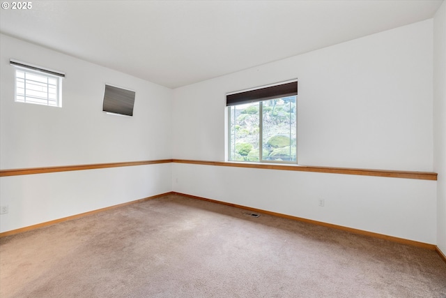 unfurnished room featuring carpet floors